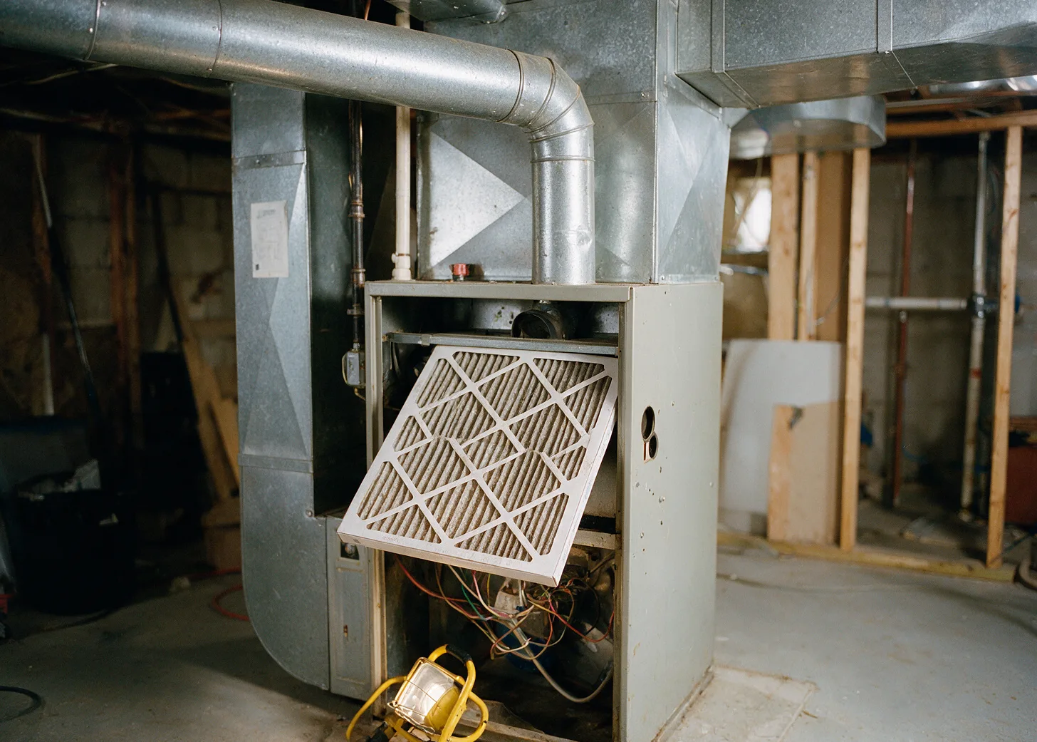 A basement furnace with the filter pulled